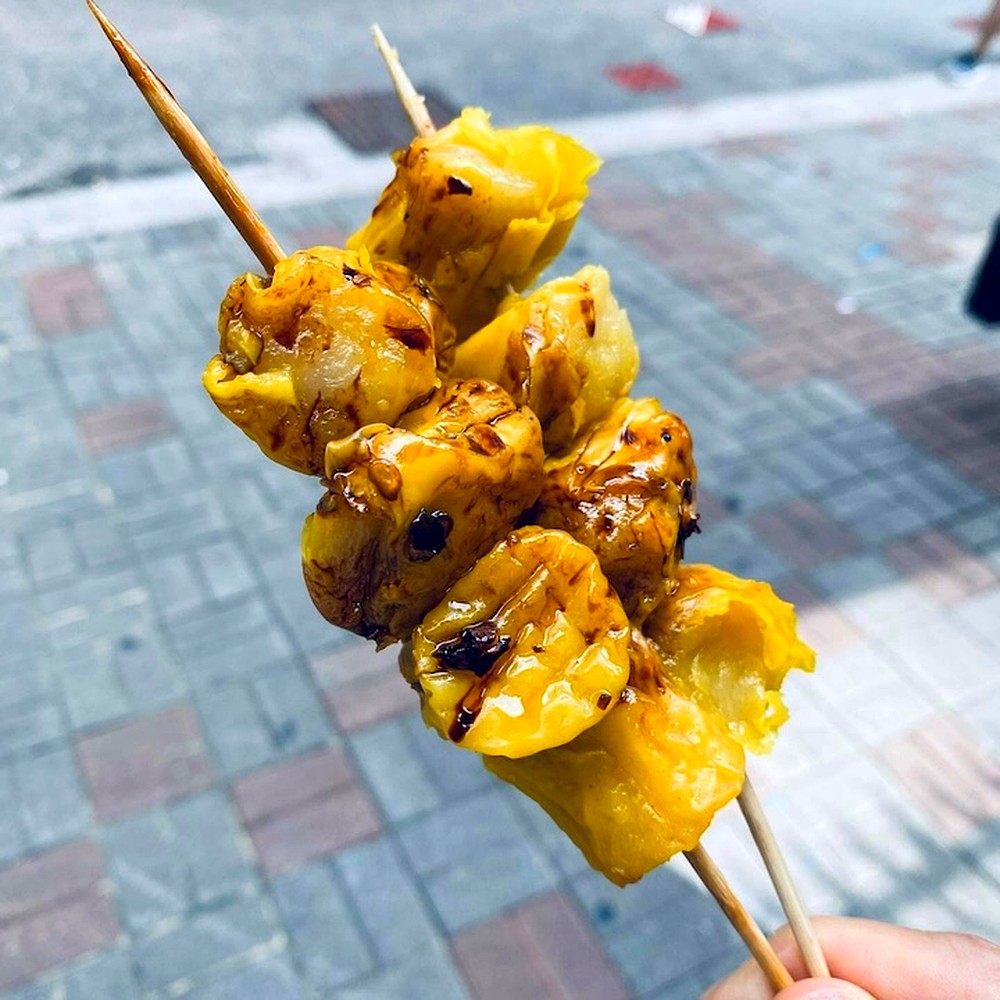 Street-style siu mai on skewers, glazed with soy and chilli