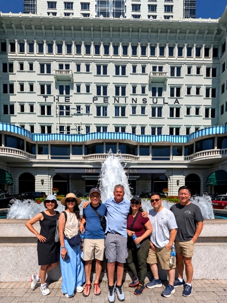Tour group at The Peninsula Hong Kong — Hans with six happy guests