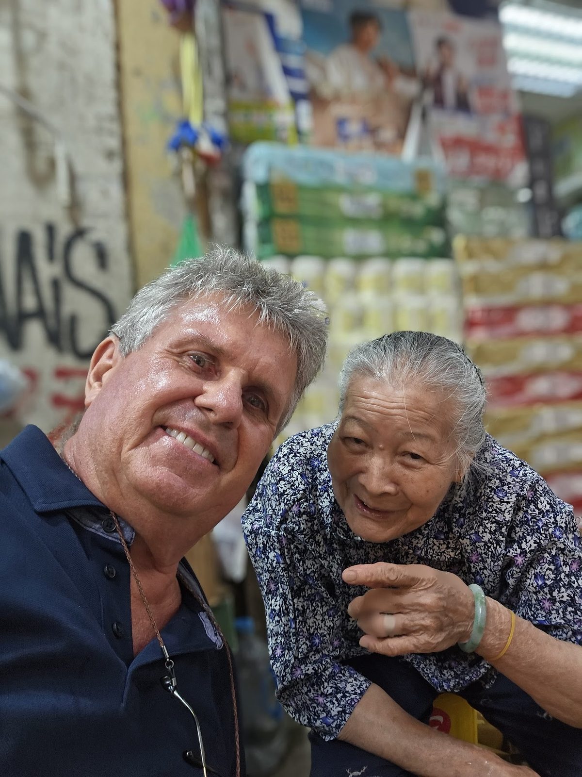 Hans with his friend, an elderly cardboard collector, at Wan Chai market