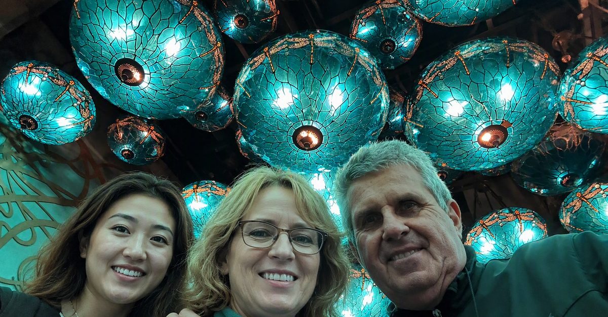 Hans with guests under lanterns at Tai Kwun