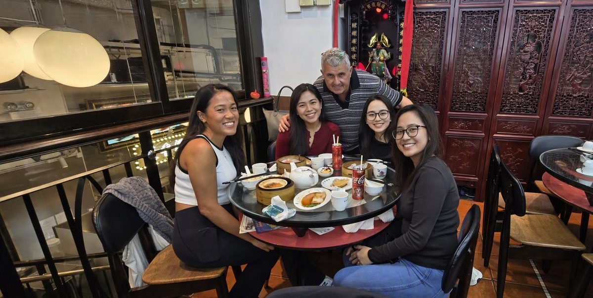 Hans with guests in a traditional teahouse